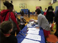 Employee giving out safety information to the public